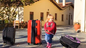 Girl with suitcases