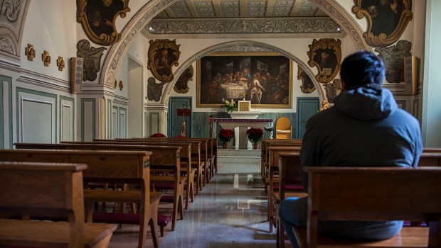 MAN PRAYING CHURCH