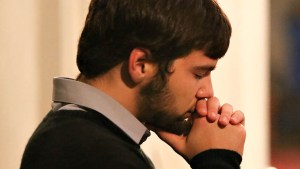 MAN PRAYING