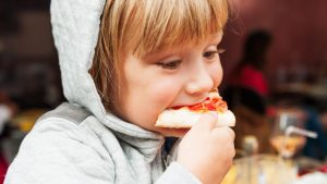 CHILD EATING PIZZA