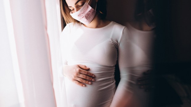 web3-young-pregnant-woman-in-medical-mask-shutterstock_1673560747.jpg
