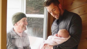 GRANDFATHER SEEING GRANDDAUGHTER THROUGH WINDOW