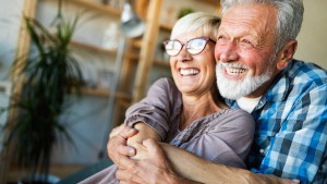 happy elderly couple man woman laughing