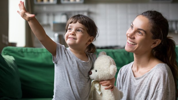 Young girl and mom looking forward to good future