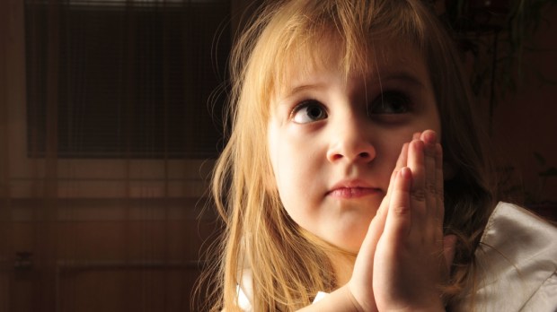 young praying girl