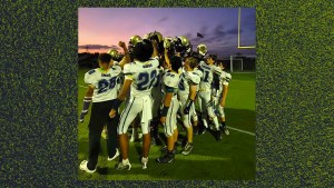 St. Joseph Academy High School football team, gathered on the field at dusk after a game.