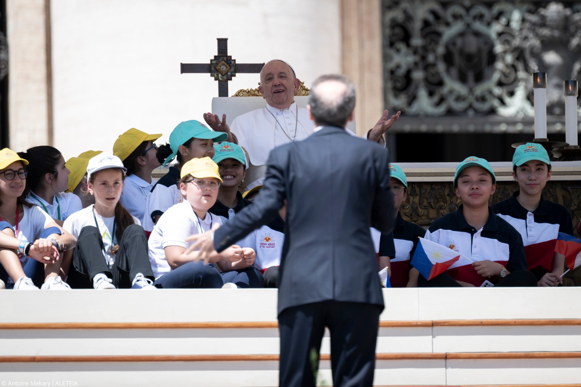 Pope Francis (up) listens to a speech by Italian film director Roberto Benigni during a mass on World Children's Day at St Peter's Basilica in the Vatican on May 26, 2024.