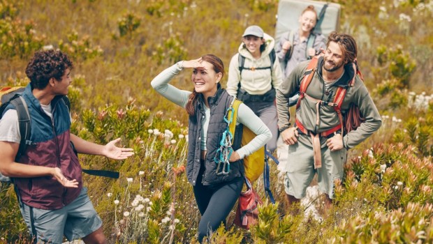 Group hiking, nature travel and guide in communication with friends